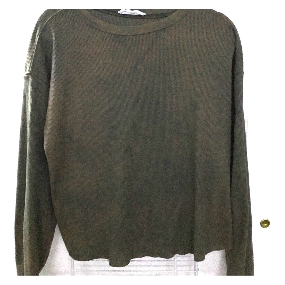 Long sleeve, loose crop top.